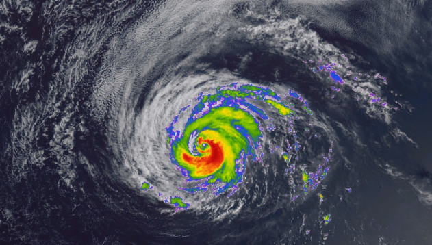 Hurricane Fausto Expected to Weaken Before Reaching Hawaii, Officials Warn Satellite image of Hurricane Fausto over the Pacific Ocean approaching Hawaii with storm clouds and rough seas.