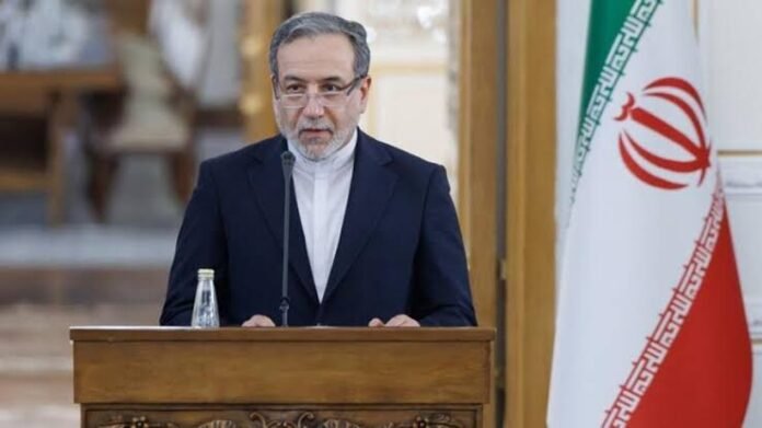 Iranian Foreign Minister Abbas Araghchi speaking at a press conference while calling for a diplomatic solution to the ongoing Yemen conflict