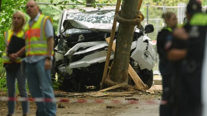 German Police Hunt Attacker After Vehicle Rams Into Crowd in Berlin German police officers secure the scene after a vehicle rammed into a crowd in Berlin as emergency responders assist injured pedestrians.