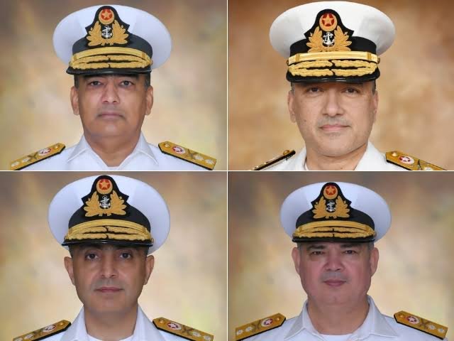 Four newly promoted Pakistan Navy Rear Admirals in white naval uniforms following their promotion from Commodore to Rear Admiral.