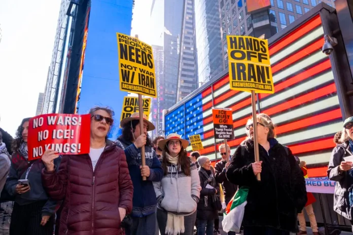Only One in Three Americans Support Iran War, New Poll Finds An American flag and a map of Iran symbolizing declining U.S. public support for the ongoing Iran war following a new Reuters/Ipsos poll.