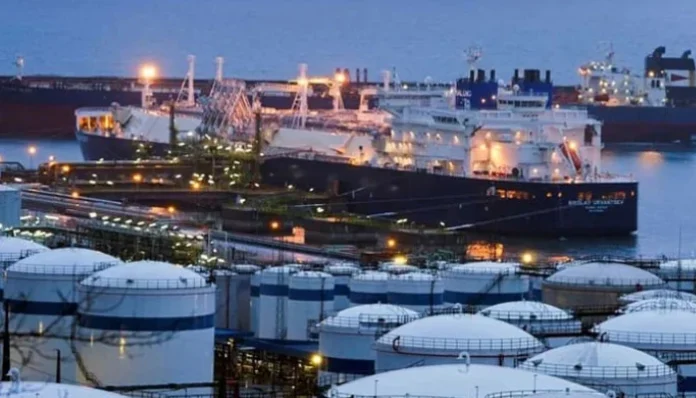 An LNG terminal with storage tanks and gas infrastructure representing Pakistan's RLNG supply amid rising energy prices and supply disruptions.