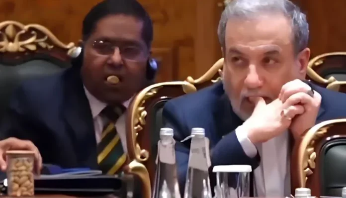 Indian MEA spokesperson Randhir Jaiswal eating nuts during a BRICS Summit session in New Delhi.
