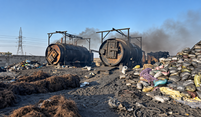 Authorities inspect an illegal tyre pyrolysis plant in Karachi’s Keamari district