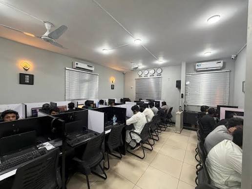 NCCIA officials conduct a raid at alleged fraud call centers in PECHS, Karachi