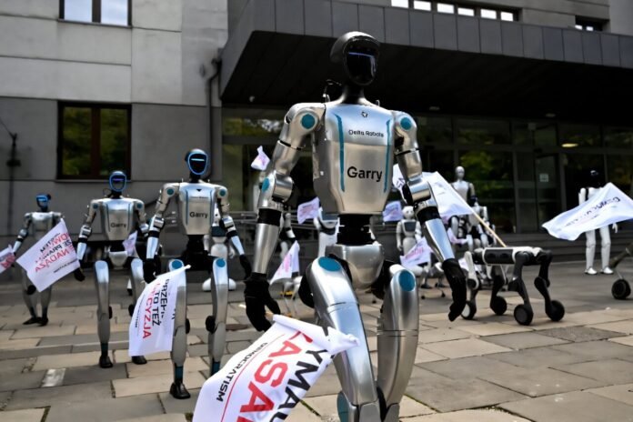 Humanoid and quadruped robots demonstrate for stronger AI regulation in Warsaw